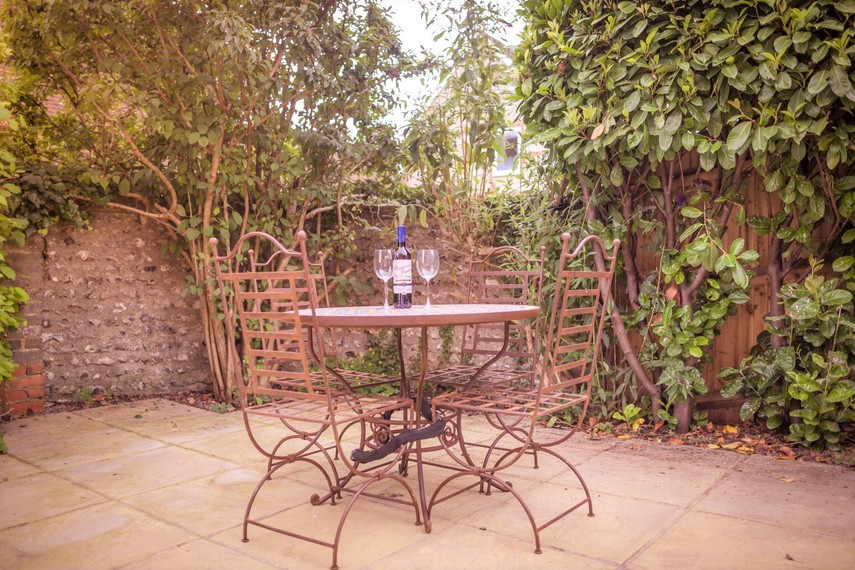 Rear garden with patio table in South Downs cottage